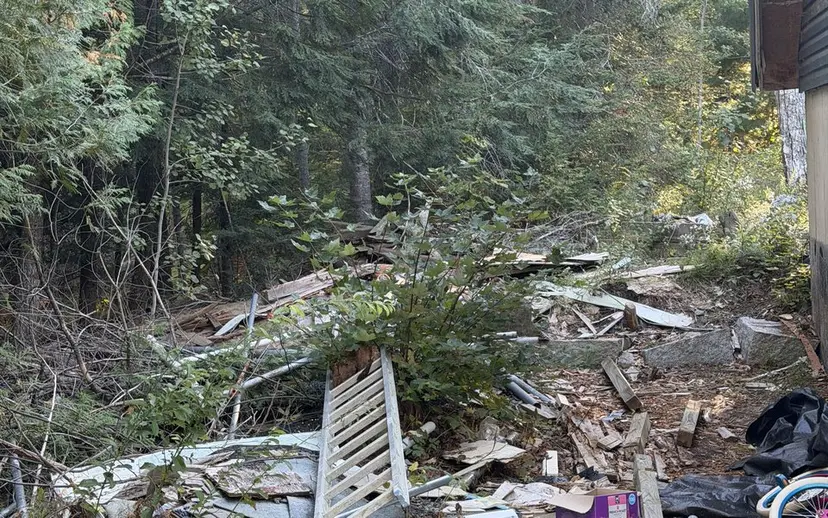 Renovation debris gathered beside a building