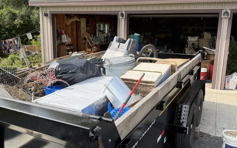 Open garage with items being staged for removal