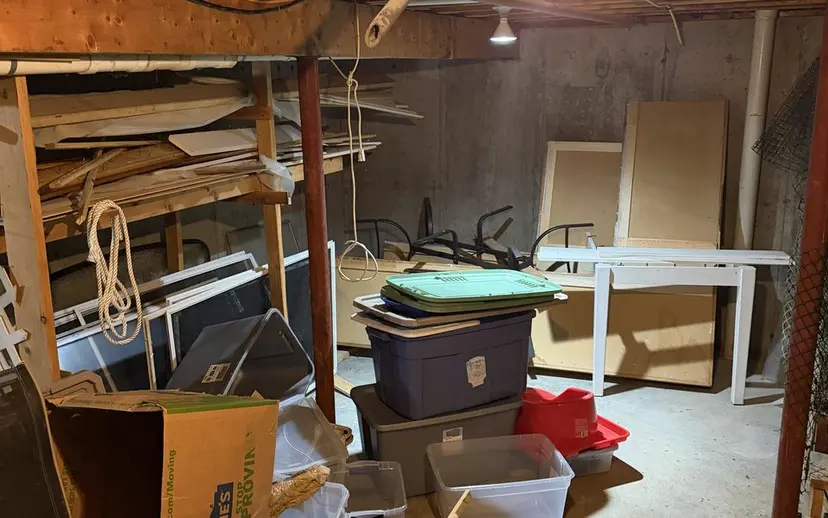 Boxes and household goods in a basement before removal